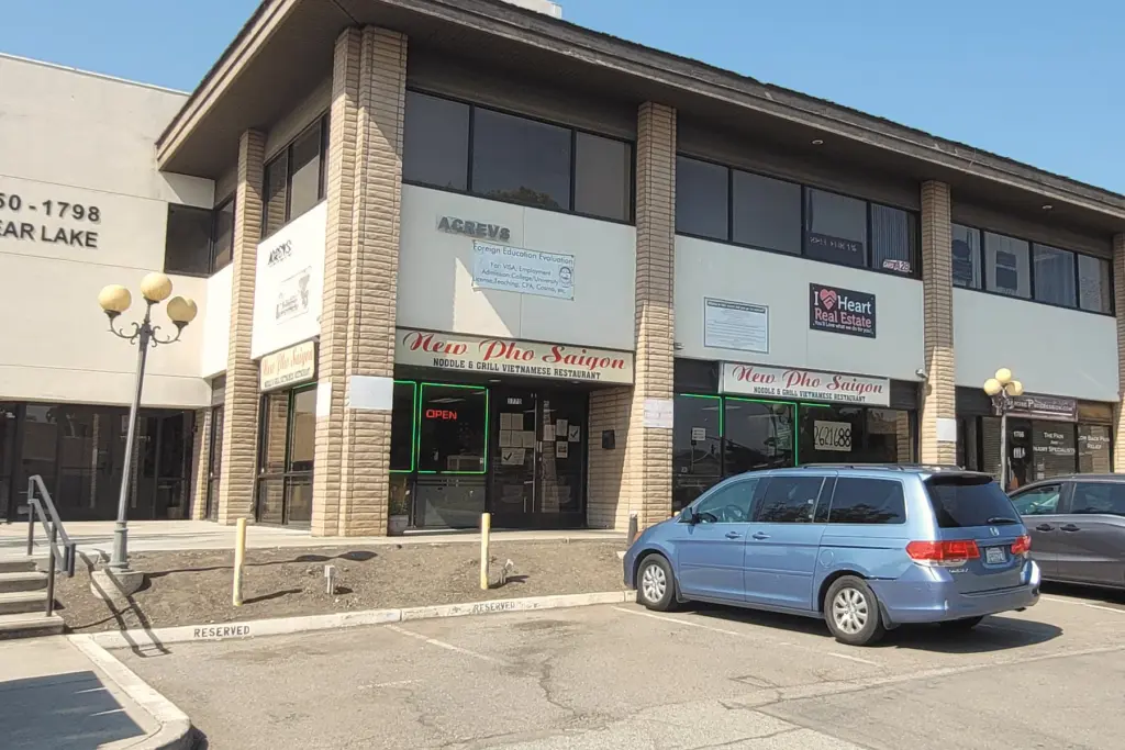 The two-storey office building at 1750–1798 Clear Lake Avenue, with steps up from the parking lot